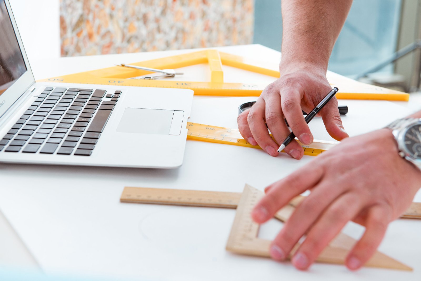 male engineer working on drawings and blueprints