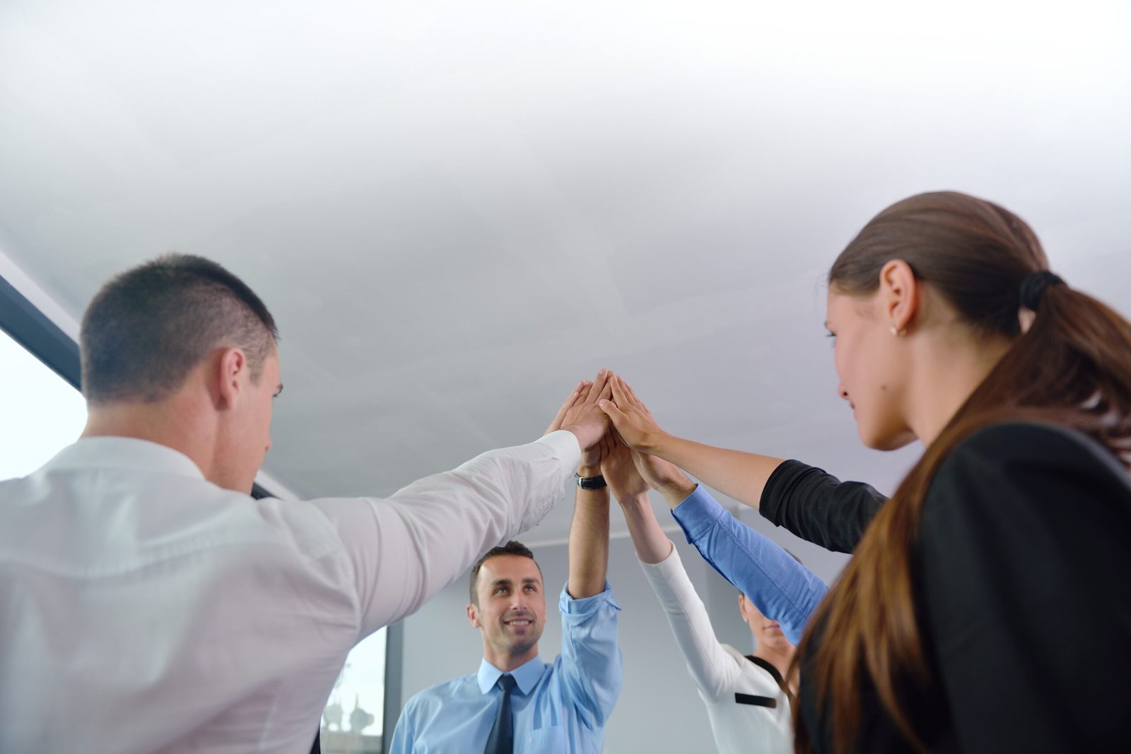 business people group joining hands