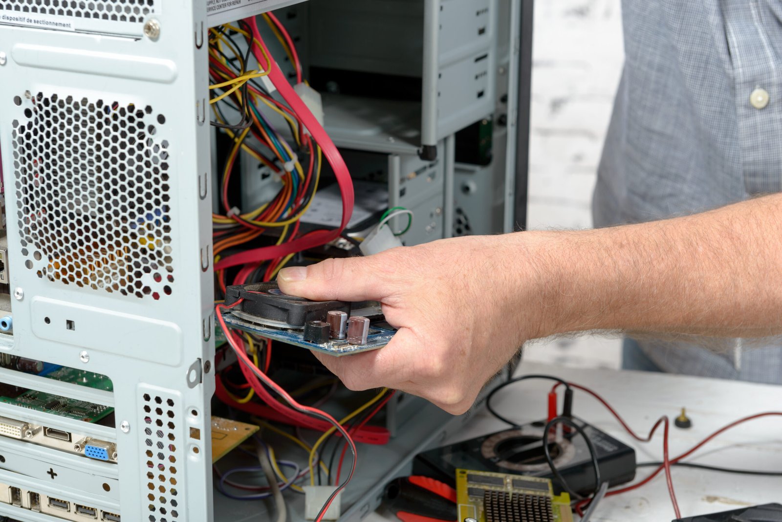 a technician repairing a computer